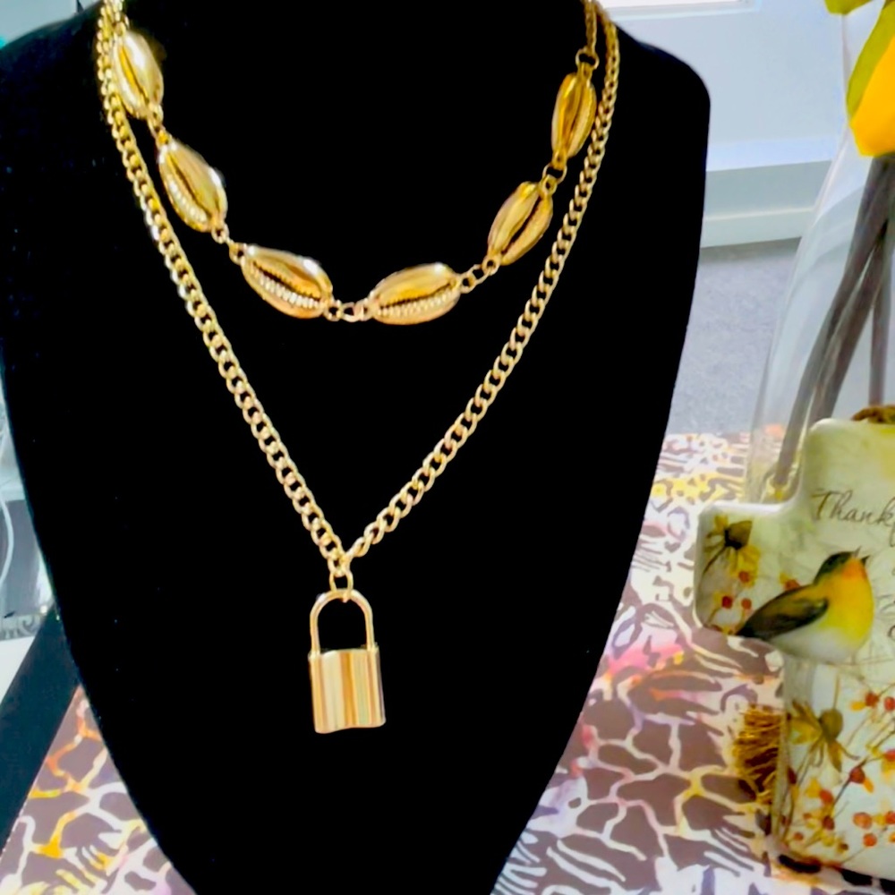 beautiful fine fantasy necklace with several chains and a padlock